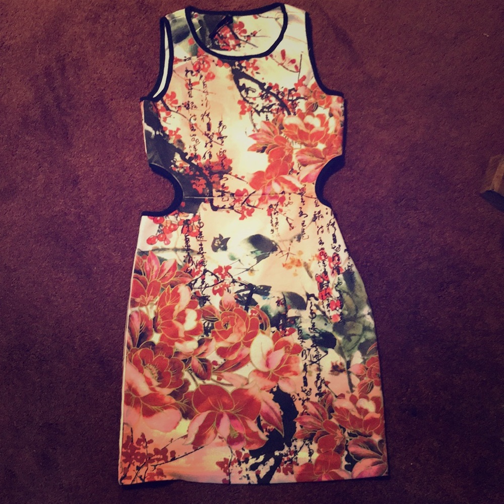 A short graphic print dress with cut outs